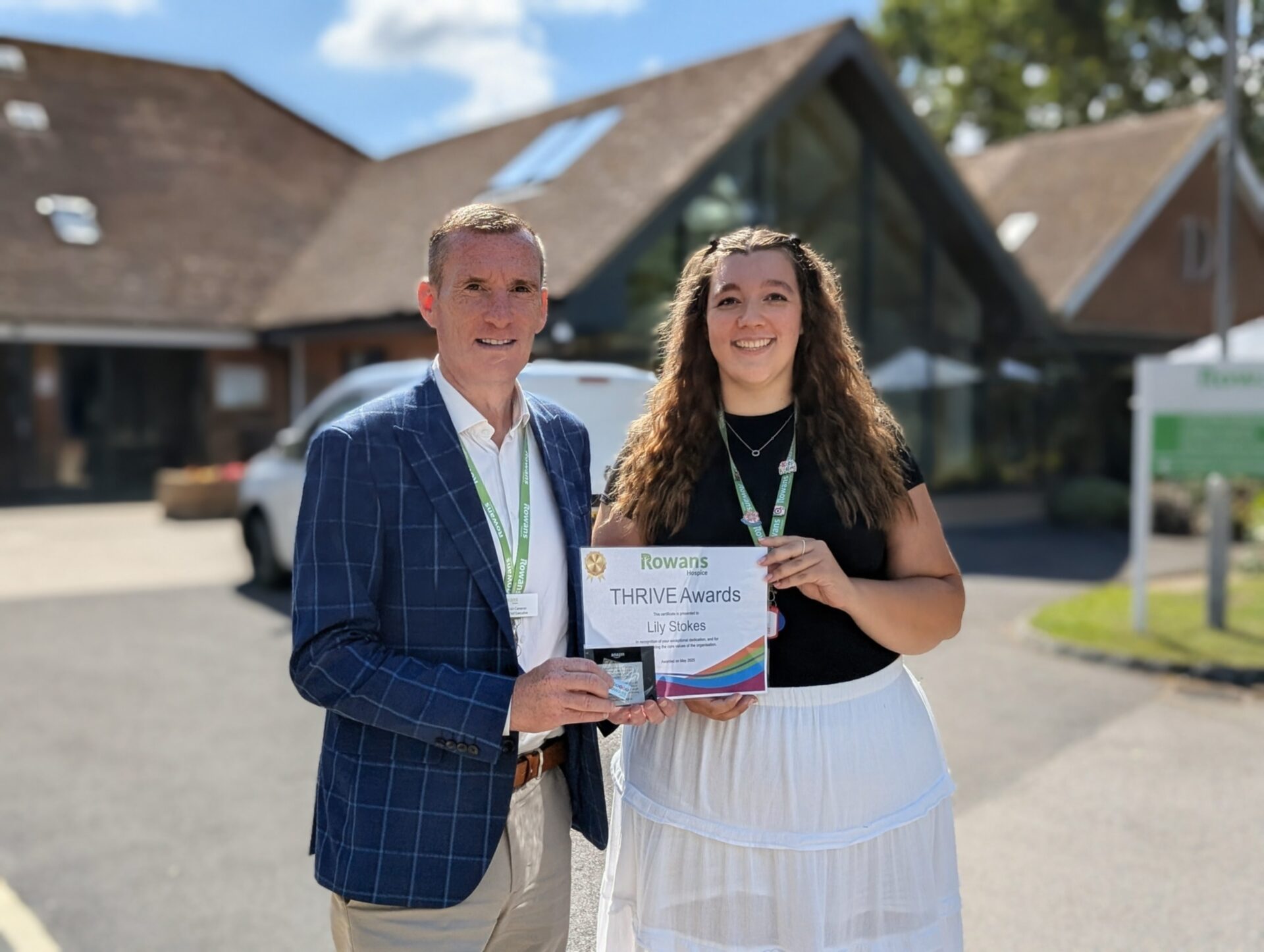 Image showing Lily Stokes receiving Thrive Award from Iain Cameron