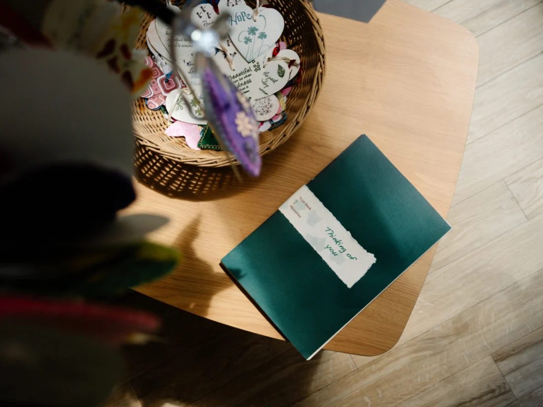 Image showing Rowans Hospice quiet space memory book and paper hearts