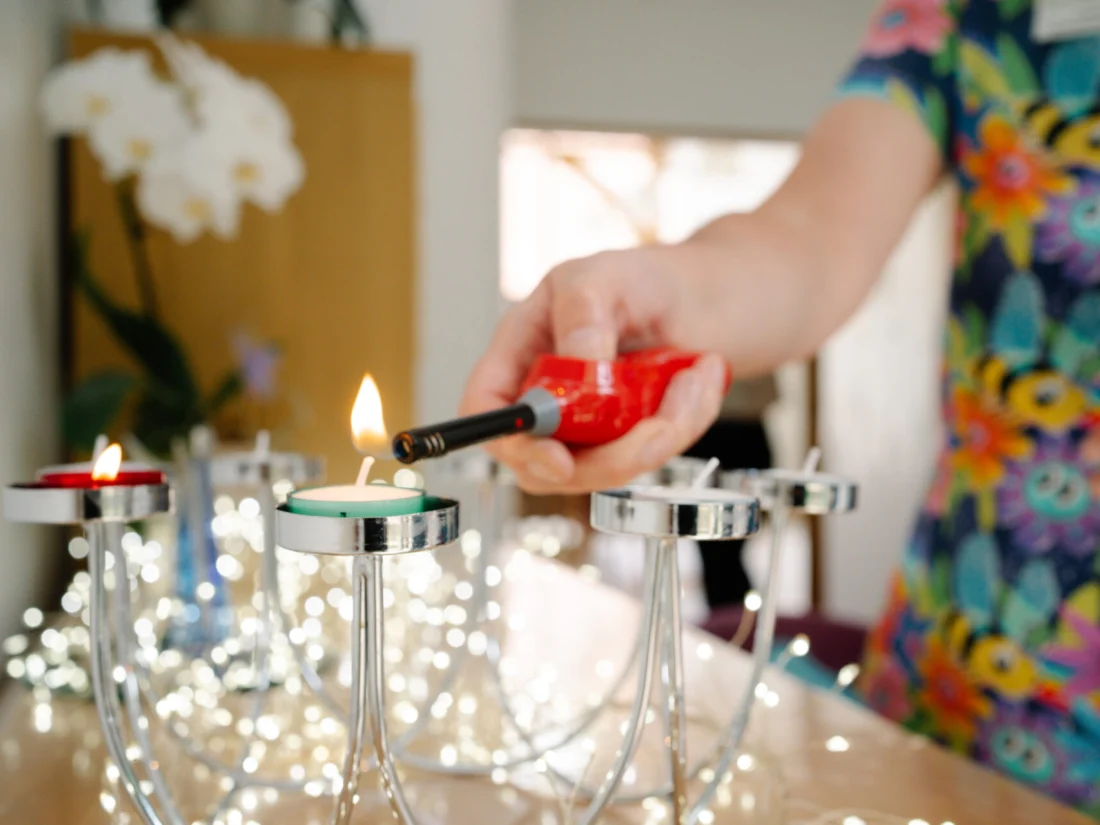 Image showing Rowans Hospice quiet space with a candle being lit