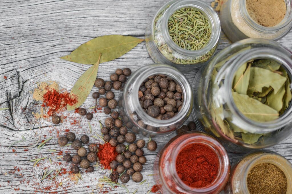 Table with spices in jars for cooking course promo