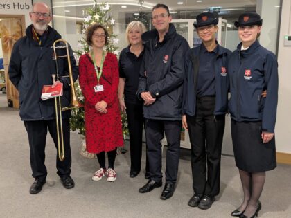 carol band standing with their instruments