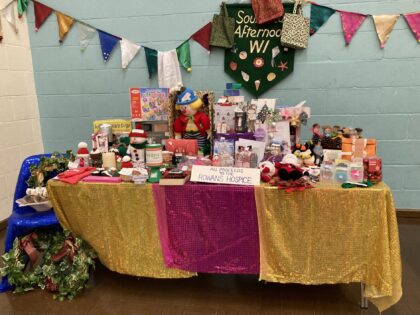 christmas fayre with crafted colourful items across the table